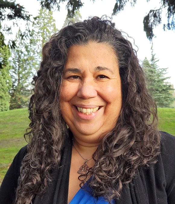 Gema Sanchez, PT smiles for the camera in a park setting